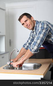 Plumber fixing domestic sink