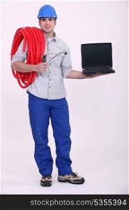 plumber holding a laptop