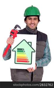 Plumber holding wrench and energy rating sign