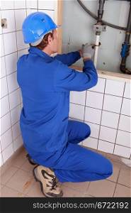 Plumber repairing water pipes