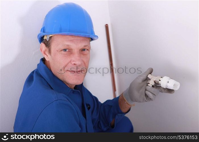 Plumber with a thermostatic radiator valve