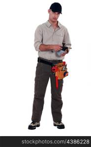 Plumber with blowtorch, studio shot