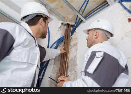 plumbers working in home being renovated