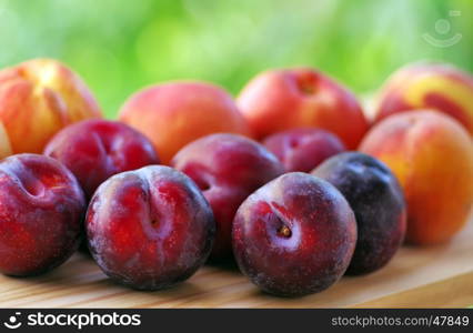 plums and peaches on table