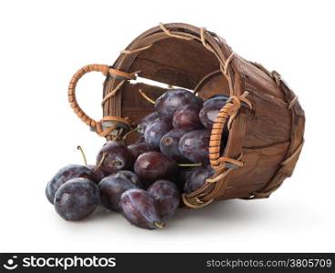 Plums in a basket isolated on white