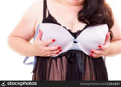 Plus size big adult woman wearing black lace lingerie holding full cup bra, on white. Bosom, brafitting and underwear.. Woman plus size holding bra