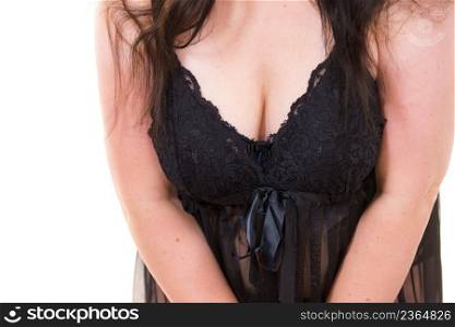 Plus size chubby woman wearing black lace lingerie babydoll showing her chest breasts. Underwear concept.. Woman in black lingerie showing her breast chest.