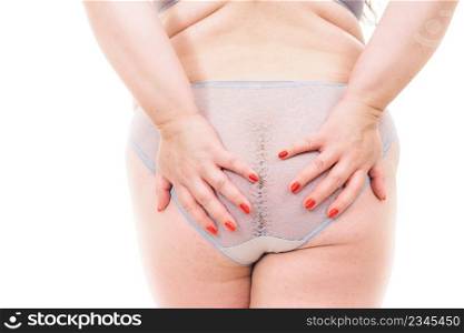 Plus size woman wearing lace panties lingerie, back view. Big body, underwear concept.. Plus size woman in lingerie back view.