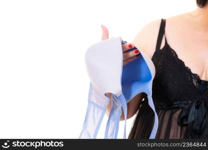 Plus size woman wearing lingerie holding ful cup bra, on white. Bosom, brafitting, underwear and female dilemmas.. Woman plus size holding bra