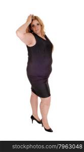 Plus size young woman standing isolated for white background withher hand on her head, in high heels.