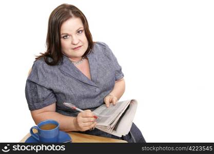 Plus-sized businesswoman reads classifieds, discouraged by poor job market. Isolated on white.