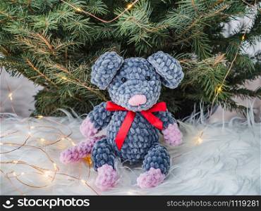 Plush toy, Christmas tree and Christmas decorations. Close-up side view. Concept of preparing for the holiday. Plush toy, Christmas tree and Christmas decorations