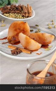 Poached pears delicious home made recipe over light kitchen countertop