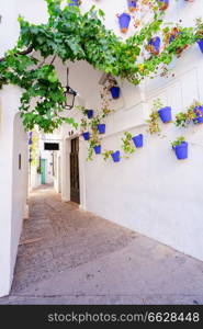 Poble Espanyol narrow street, with traditional for Andalusia white walls architecture, Barcelona, Catalonia Spain. Poble Espanyol, Barcelona