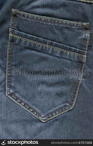 Pocket of blue jeans. Back pocket of blue jeans close-up as background.