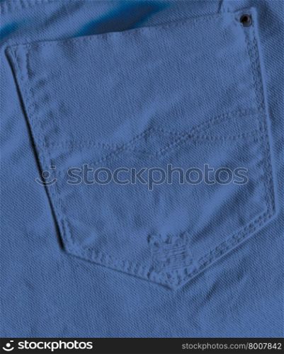 Pocket of blue jeans. Back pocket of jeans close-up as background.