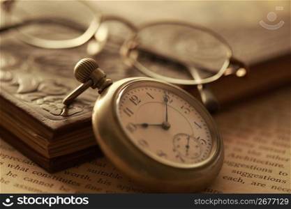 Pocket watch and Book