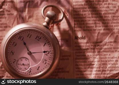 Pocket watch and Newspaper