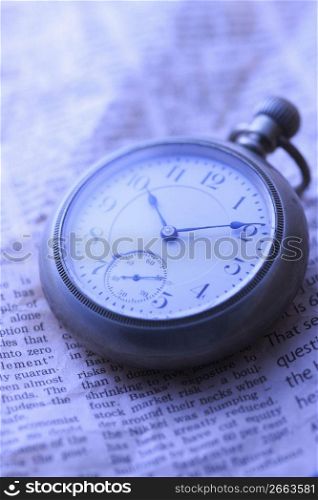 Pocket watch and Newspaper