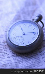 Pocket watch and Newspaper