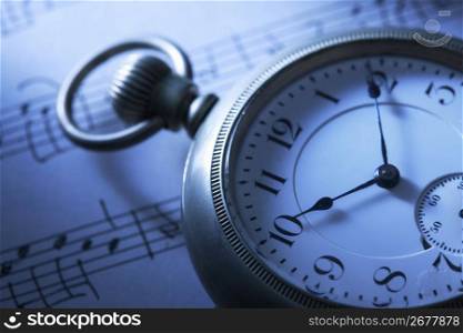 Pocket watch and Sheet music
