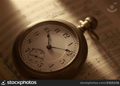 Pocket watch and Sheet music