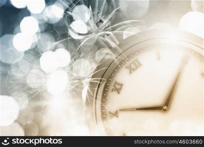 Pocket watch. Conceptual image with pocket watch bokeh lights and fireworks