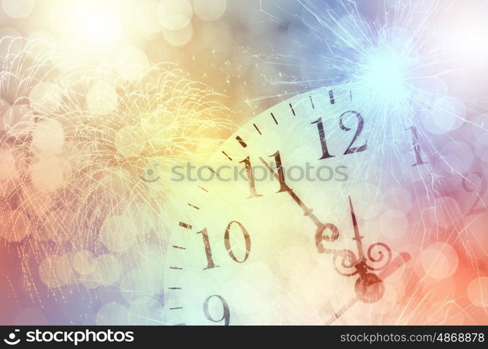 Pocket watch. Conceptual image with pocket watch bokeh lights and fireworks