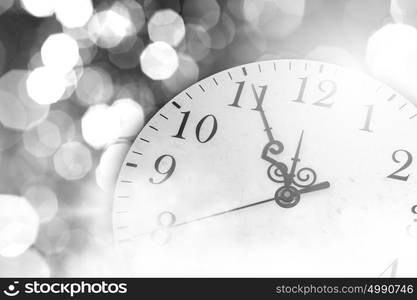 Pocket watch. Conceptual image with pocket watch bokeh lights and fireworks