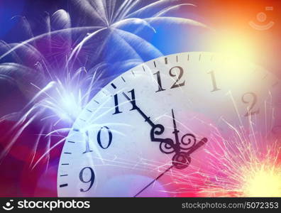 Pocket watch. Conceptual image with pocket watch bokeh lights and fireworks