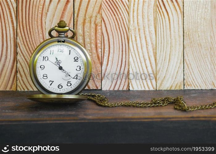 Pocket Watch On Vintage Wood