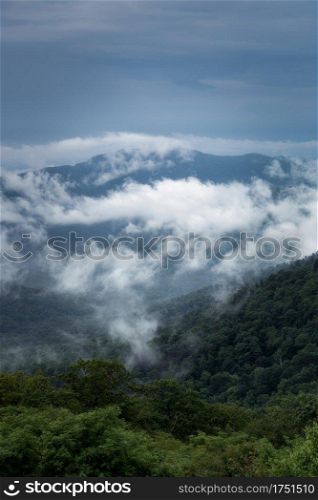 Pockets of mist and fog obscure the view towards Old Rag Mountain in Shenandoah National Park during the Summer.