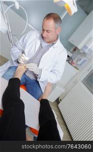 podiatrist working in clinic
