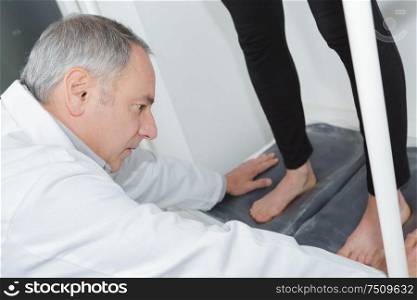 podiatrist working with foot