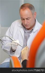 podiatry doctor treating patients foot