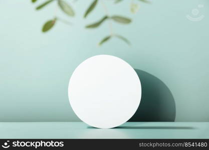 Podium for cosmetic product presentation. Abstract minimal geometrical form. Cylinder podium with eucalyptus leaves, geometric shadows. Scene to show products. Showcase, display case.