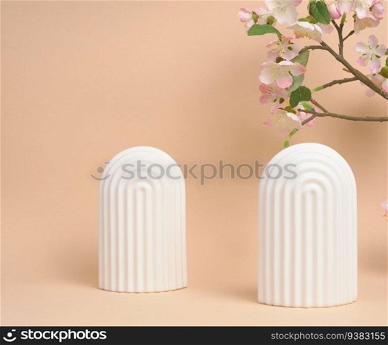 Podium with white arches to showcase cosmetics, products and other merchandise