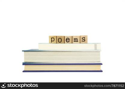 poems word on wood stamps stack on books, poetry and literature concepts
