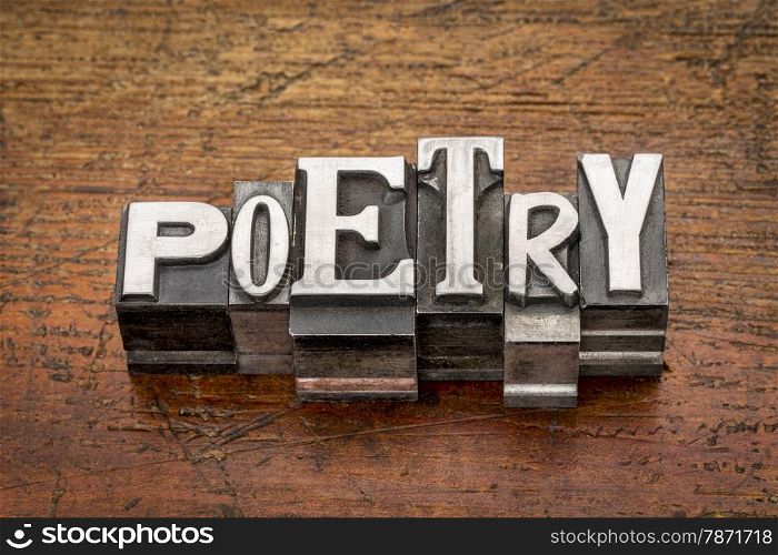 poetry word in mixed vintage metal type printing blocks over grunge wood