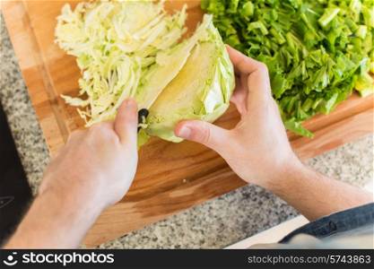 Point of view of man cooking vegetables