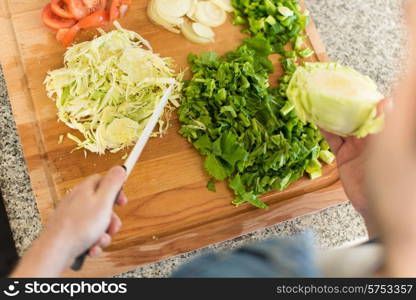 Point of view of man cooking vegetables