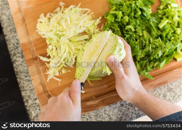 Point of view of man cooking vegetables