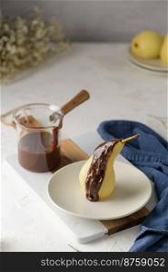 Poire belle Helene - French dessert made from poached pears served with chocolate ganache.