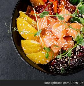 Poke bowl with salmon, cucumber, pepper and orange