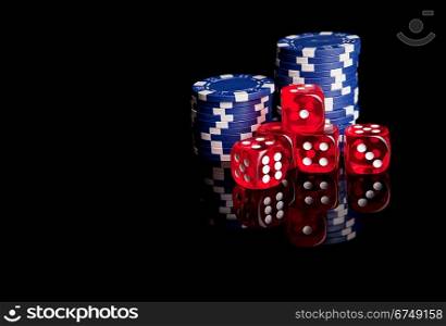 Poker chips and dices, isolated over black background