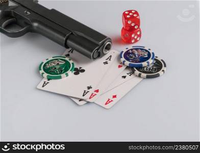 Poker chips, cards and gun on a white background. The concept of gambling and entertainment. Casino and poker. gambling poker, closeup