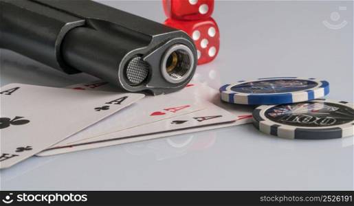 Poker chips, cards and gun on a white background. The concept of gambling and entertainment. Casino and poker. gambling poker, closeup