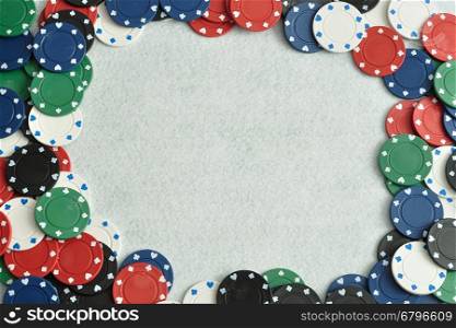 Poker chips forming a border with a white background