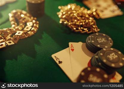 Poker concept, money bet, cards and chips on gaming table, whiskey and cigar in casino. Games of chance. Gambling house business. Poker concept, money bet, cards and chips, casino