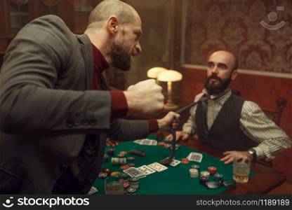 Poker player caught the sharper in casino, risk. Games of chance addiction. Men with whiskey and cigars in gambling house